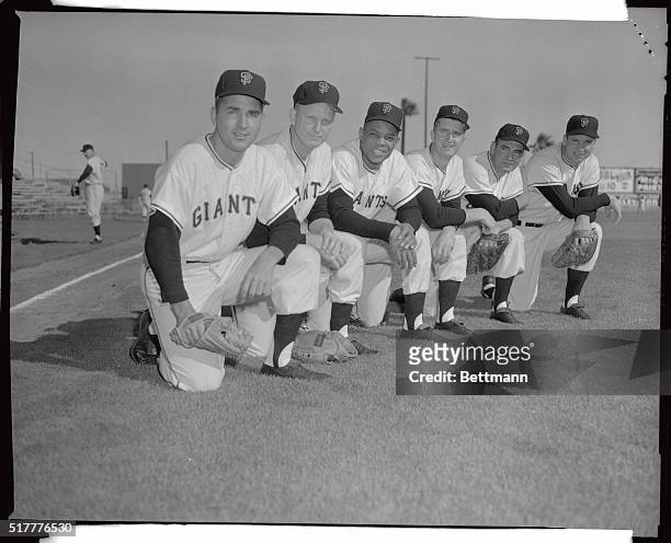 Photo at left above shows Marv Grissom watching Pete Burnside take a practice pitch at the Phoenex, Arizona spring training camp of the San Francisco...