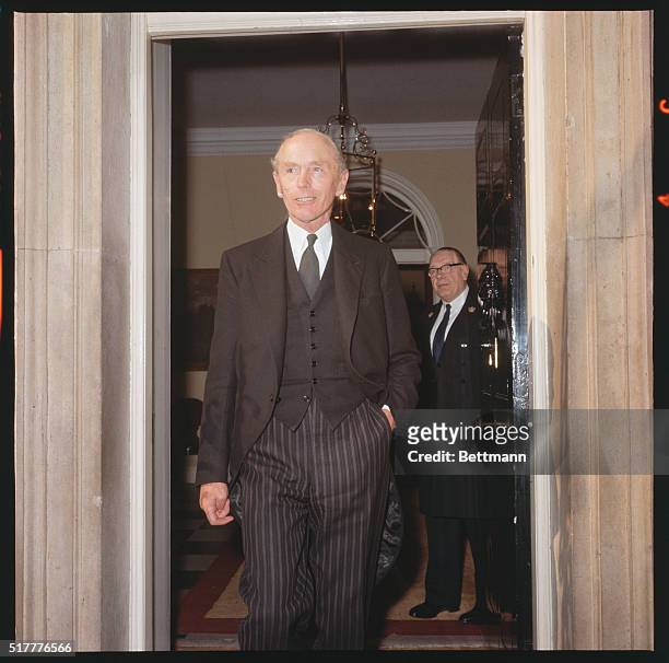 Britain's prime minister, Sir Alec Home, stepping out of No. 10 Downing Street.