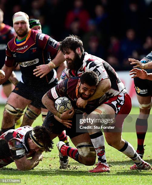 Dragons player Taulupe Faletau is stopped just short of the try line by Cornell Du Preez of Edinburgh during the Guinness Pro 12 match between...