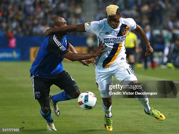 Gyasi Zardes of the Los Angeles Galaxy and Marvell Wynne of the San Jose Earthquakes vie for position to the ball during the second half of their MLS...