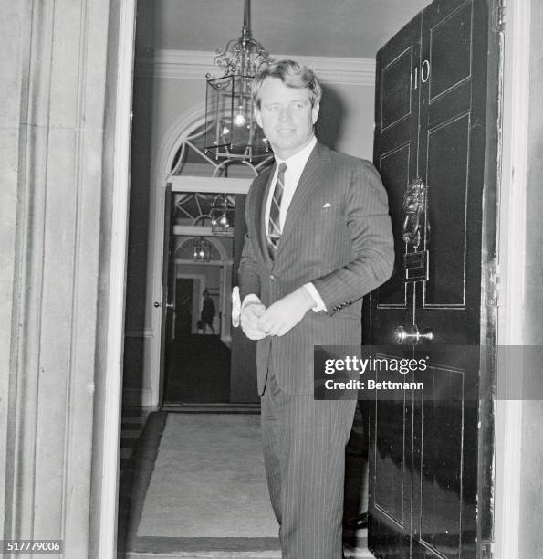 Senator Robert Kennedy is shown wearing a pin striped suit, as he bids farewell to Prime Minister Harold Wilson at the door of 10 Downing Street,...