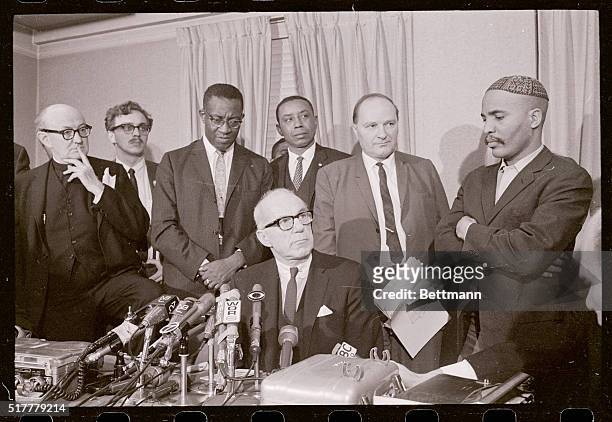 As Dr. Benjamin Spock answers newsmen's questions, leaders of the April 15 anti-Vietnam peace march stand by April 14. From left are: Monsignor...