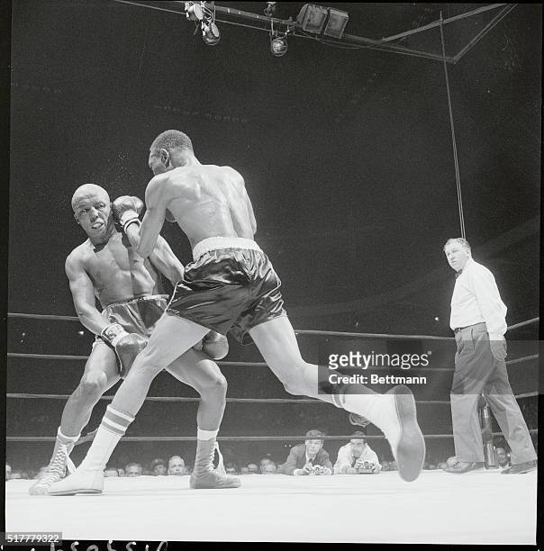 New York, New York: At the moment, Gypsy Joe Harris appears to be getting the worst of it as welterweight champion Curtis Cokes tags him with a left...