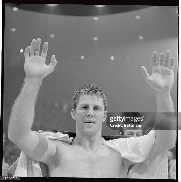 Jerry Quarry raises his hands in victory after he beat Thad Spencer to win the WBA heavyweight championship elimination fight here 2/3. Quarry, the...