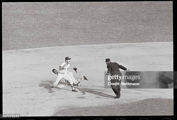 Fenway Park: Speedy Lou Brock makes game-winning steal of second base in seventh inning--just sliding in under rookie catcher Russ Gibson's high...