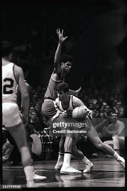 S Lew Alcindor makes his long, lean presence felt against Keith Hochstein , of Holy Cross, on the Madison Square Garden court here January 26th....