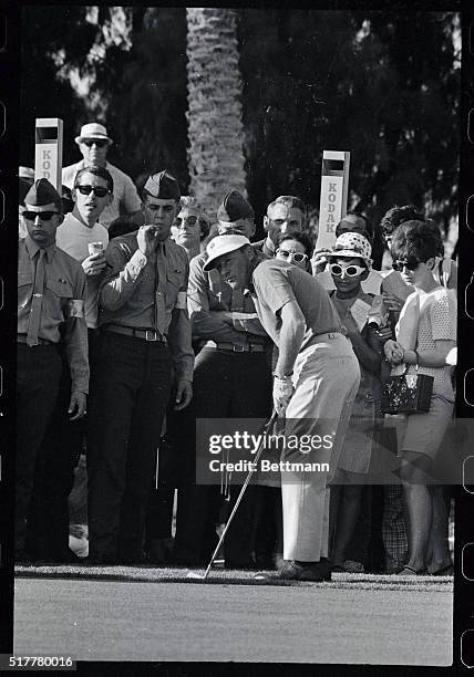 Deane Beman misses a putt on the 16th green during sudden death playoff to break the first place tie between Beman and Arnold Palmer in the Bob Hope...