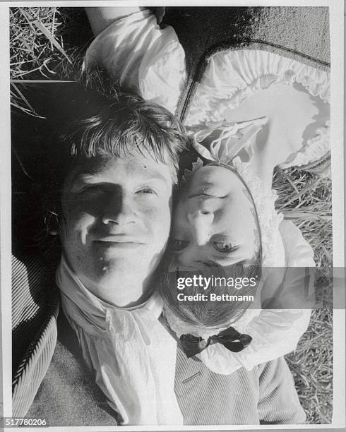 The sunlight catches John Hurt and Pamela Franklin, the youthful romantic leads in the movie Sinful Davey, as they lie on the grass in Scotland. Hurt...