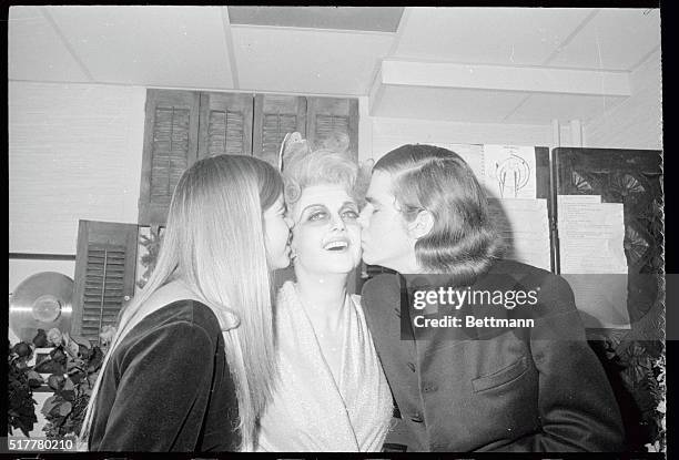 Angela Lansbury is kissed by her children, Dede and Anthony following her opening night performance in "Dear World" at the Mark Hellinger Theatre...