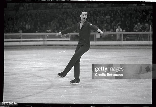 Tim Wood, of Bloomfield Hills, Michigan, does a graceful kick during his free skating performance in the Olympic men's skating event here. Wood, the...