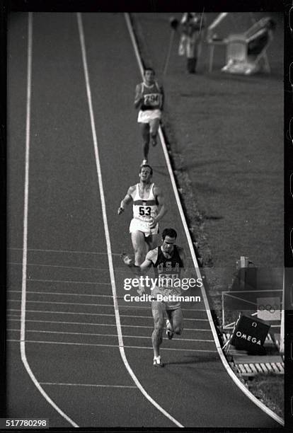 Bill Toomey is seen here in the Decathlon 1500 Meter Run, and he is in the lead.