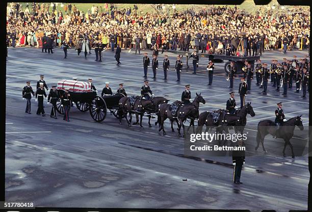 Views of the caisson bearing casket of Dwight D. Eisenhower en route to the nation's Capitol where it will lie in state.