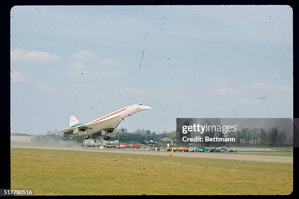 Off the ground...for the very first time...is the British-built prototype of the Anglo-French supersonic airliner "Concorde 002"...The liner, piloted...