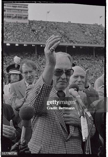 The "Galloping Ghost" Red Grange is honored by University of Illinois fans at half-time ceremonies marking the 50th anniversary of Memorial stadium...