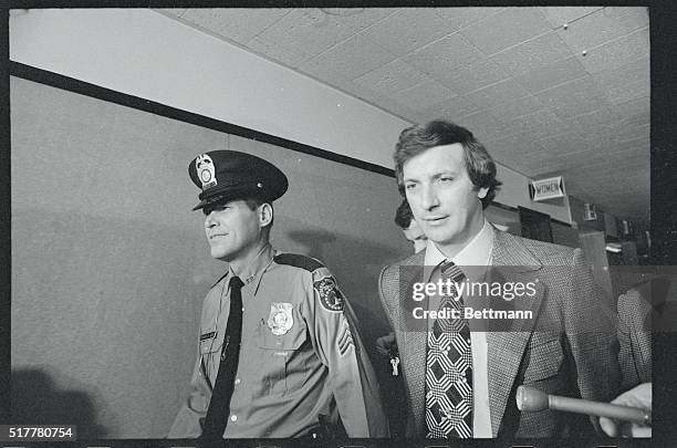 Stephen Andretta, of Little Ferry, New Jersey, is led off to jail by Sgt. Thomas E. Boyd, of the Federal Protective Service, after a judge ordered...