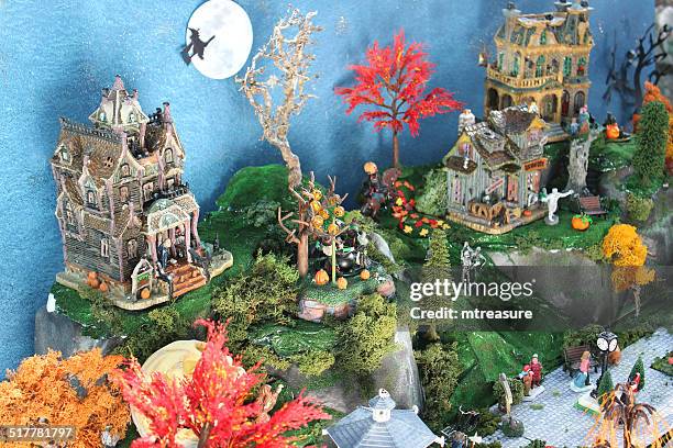 model halloween village, miniature people, haunted-house, flying witch, broomstick, full-moon - haunted mansion exterior stock pictures, royalty-free photos & images