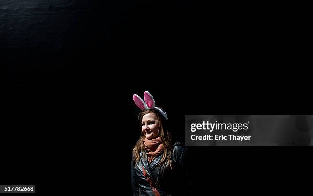 Woman stands with rabbit ears during the Easter Parade and Bonnet Festival along 5th Avenue March 27, 2016 in New York City. The parade is a New York...