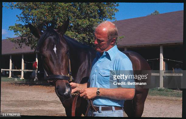 Lexington, Kentucky: Kentucky Derby favorite, Honest Pleasure, shown here with trainer LeRoy Jolley, goes to the post in the $100,000 Blue Grass...