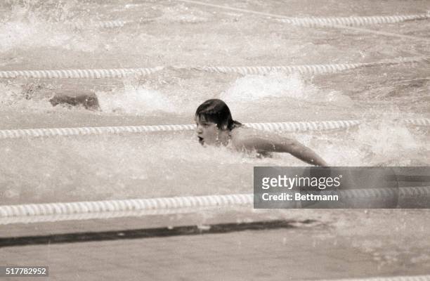 Montreal, Canada- East Germany's Andrea Pollack heads for a new Olympic record in the ladies 100-meter butterfly 7-21 with a time of 1:01,43.