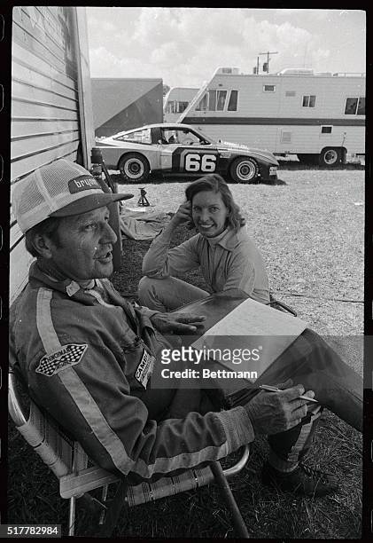 Lady race driver Janet Guthrie discusses the setup of her race car for the 12 Hours of Sebring with owner and co-driver Tom Nehl, before the start of...