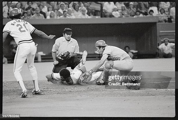 Dodger's Davey Lopes scores as Johnny Bench covers the plate for Cincinnati during first inning action here 8/6. Lopes scored from third when Reggie...