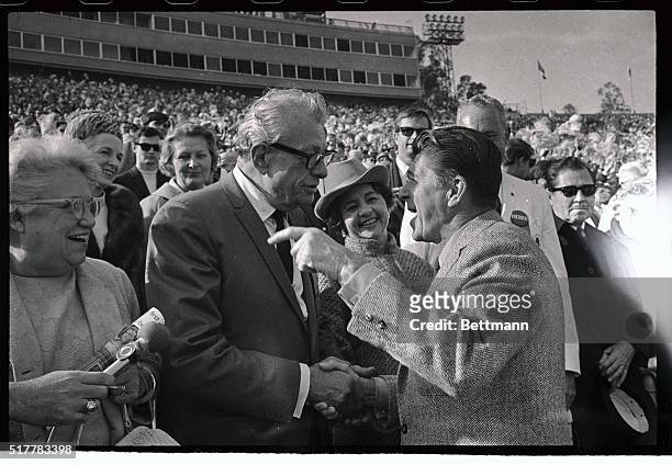 Photo shows Senator Everett Dirkson of Illinois , Grand Marshal of the Rose Parade and Governor Ronald Reagan of California as they greet each other...