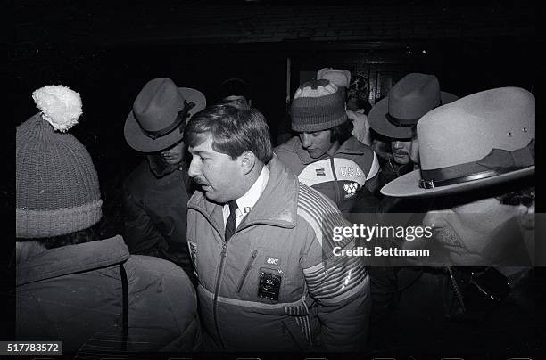 Eric Heiden is surrounded by security men as he is escorted from award ceremonies after picking up his fourth consecutive gold medal in Olympic...