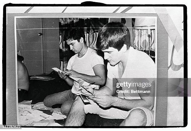 Two American hostages, one identified as Marine Guard William Gallegos , who was recently interviewed for TV broadcast, are shown reading Christmas...