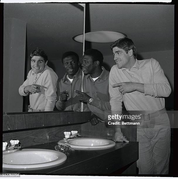 Emile Griffith , the current champion, and Nino Benvenuti look into a mirror February 27th and each man points to his choice for winner of the...