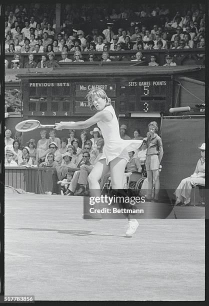 Wimbledon: Christ Evert Two hands to the racket as she smashes the ball back across the Center Court of Wimbledon as she beat Australia's Evonne...