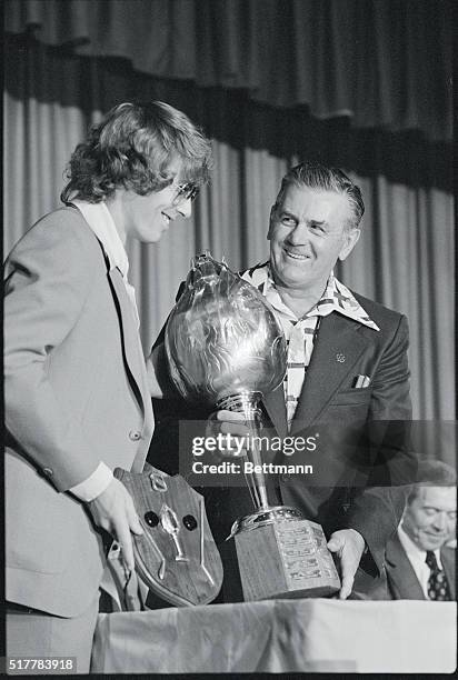 Montreal: Former Montreal Canadian's hockey star Maurice Richard , presents the Hart Trophy to Philadelphia Flyers Bobby Clarke, at the annual...