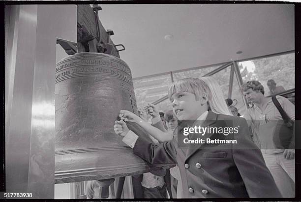 Arthur Mason of South Carolina, a descendent of George Mason, a signer of the Declaration of Independence, tap the bell to help ring in the...