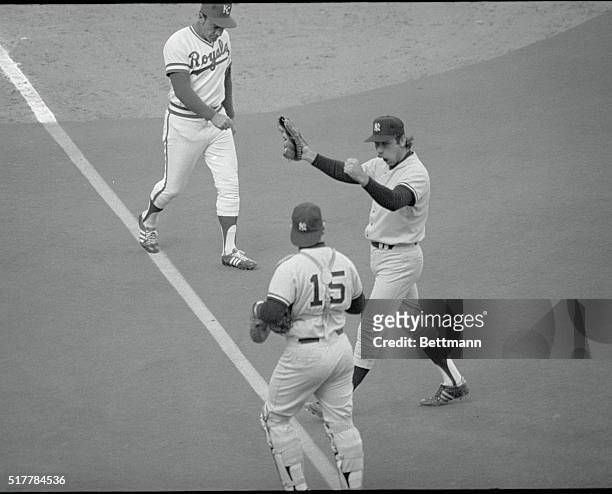 Kansas City, Kansas: Yankees catcher Thurman Munson rushes up to congratulate reliever Sparky Lyle after he pitched five and one-third scoreless...