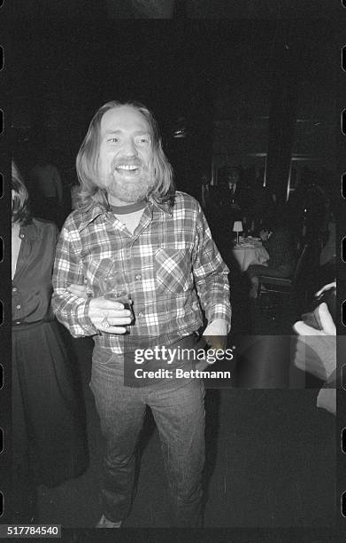 New York: Country-western singer stars Willie Nelson and Waylon Jennings celebrate at a party at the Rainbow Room in honor of their new album,...