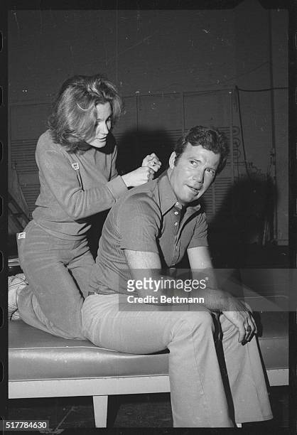 Yvette Mimieux returns the favor by giving Tricks of the Trade co-star William Shatner a back massage...however she pounds perhaps a wee bit too hard...