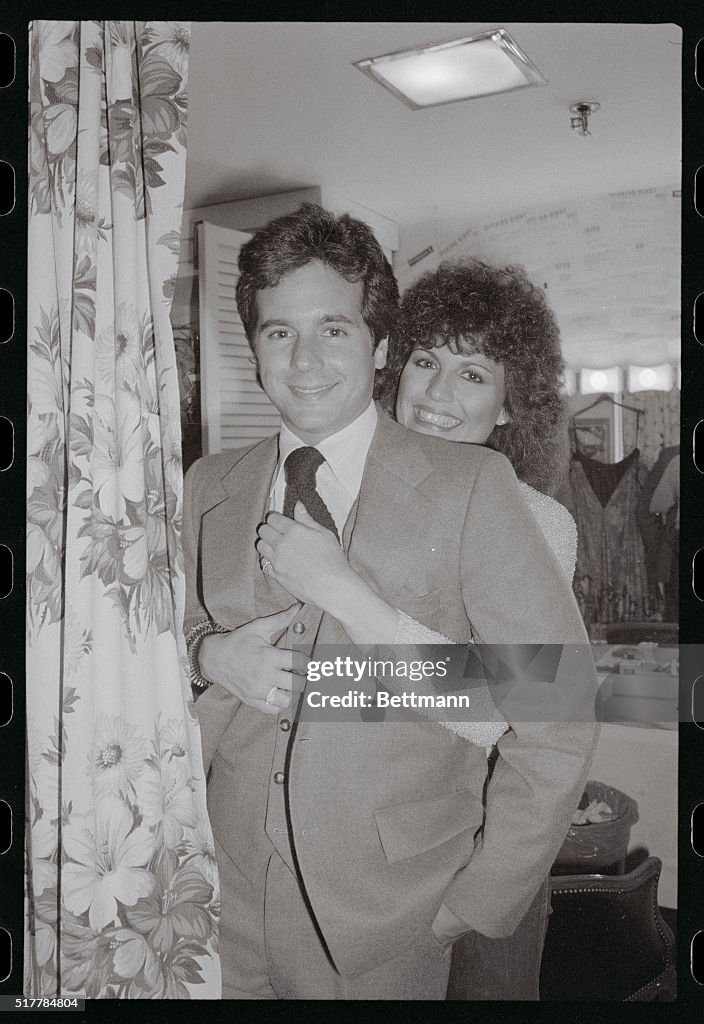 Lucie Arnaz hugs her younger brother Desi Arnaz Jr. backstage... Photo