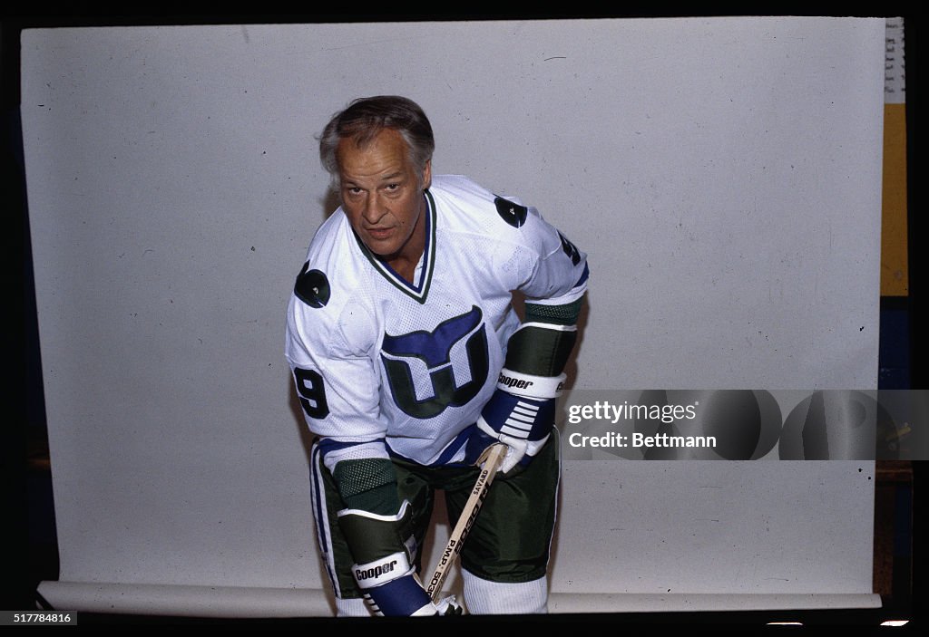 Gordon Howe Bending as if Handling Puck