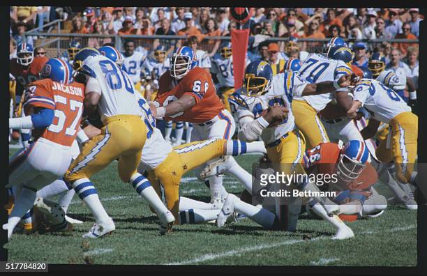 Running back for the San Diego Chargers, Clarence Williams runs along the line to try and score for a touchdown.