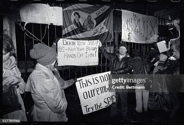 American supporters of the Iranian revolution and taking of 50 American hostages demonstrate affront the occupied U.S. Embassy here 12/15. One of the...