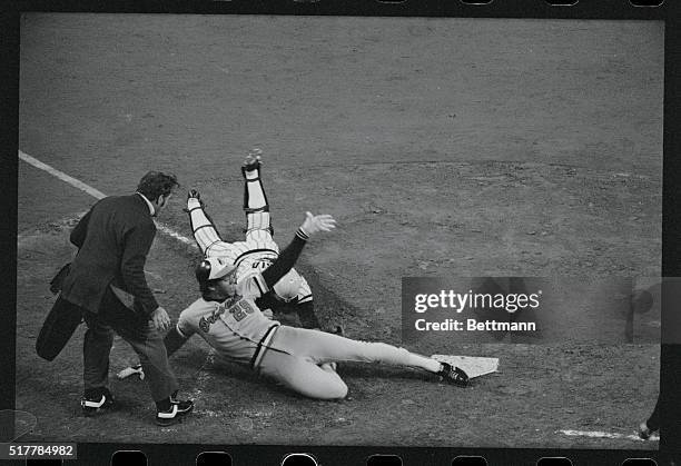 Baltimore's Ken Singleton is out at home trying to score from second on a single in the third inning of game of the World Series. A throw from Buc...