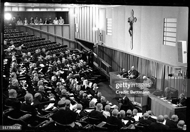 Vatican City- Pope John Paul II, standing at the Presidency table in the Synod Hall, talks to Cardinals on the opening day of the historic four-day...