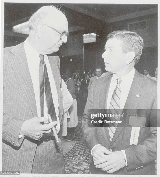 Miami: Chairman of the Federal Reserve board Paul Volcker, left, confers 9/9 with John Ashcroft, the Governor of Missouri before the opening general...