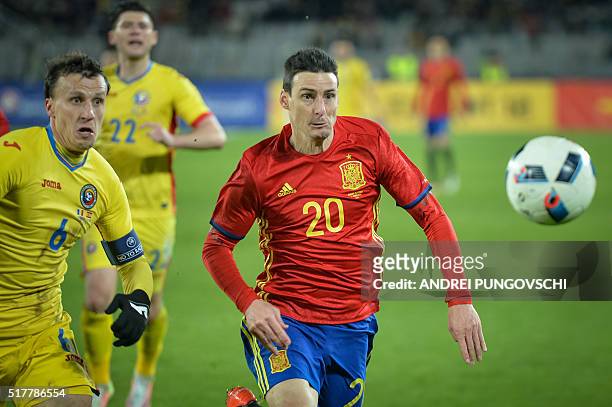 Spains Aritz Aduriz and Romanias Vlad Iulian Chiriches ie for the ball during the friendly football match between Romania and Spain in Cluj Napoca,...