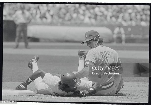 Cincinnati Reds' first baseman Pete Rose reaches back to try to tag out Dodgers' Mariano Duncan in the second inning, August 2nd. Rose took the throw...