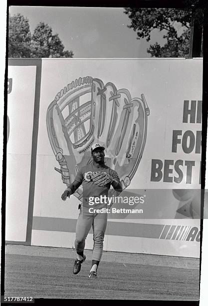 Standing in front of a giant baseball glove painted on the outfield wall, Bo Jackson goes through a little fielding practice prior to the start of...