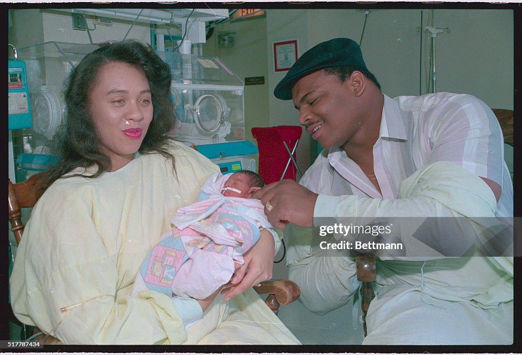 William Perry Admiring His Newborn Daughter