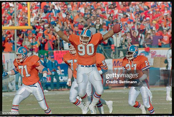 Denver: Denver's Freddie Gilbert, arms spread like an eagle, heads for Denver bench after intercepting a deflected Bernie Kosar pass at the Brown's...