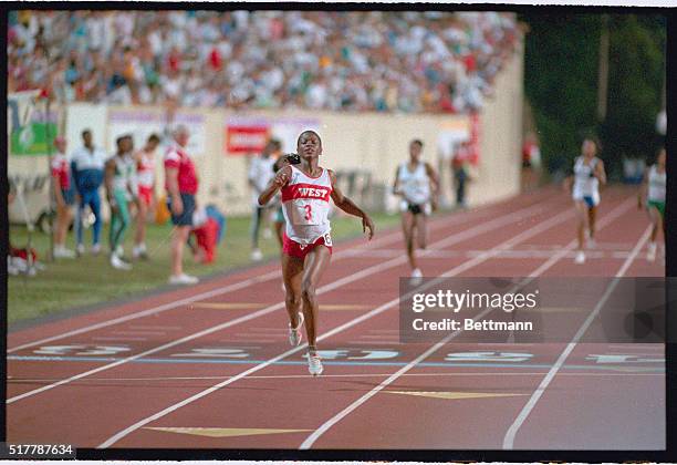 Durham, N.C.: Valerie Brisco, 1984 Olympic triple gold medalist, wins her second gold in the Olympic Festival as she crosses the finish line in the...