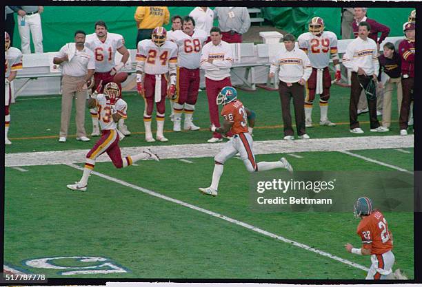 San Diego: With Denver cornerback Mark Haynes hopelessly outclassed on the play, Redskins receiver Ricky Sanders gathers in an 80-yard touchdown pass...