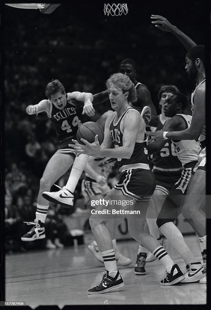 Larry Bird Attempting to Gain Control of Ball